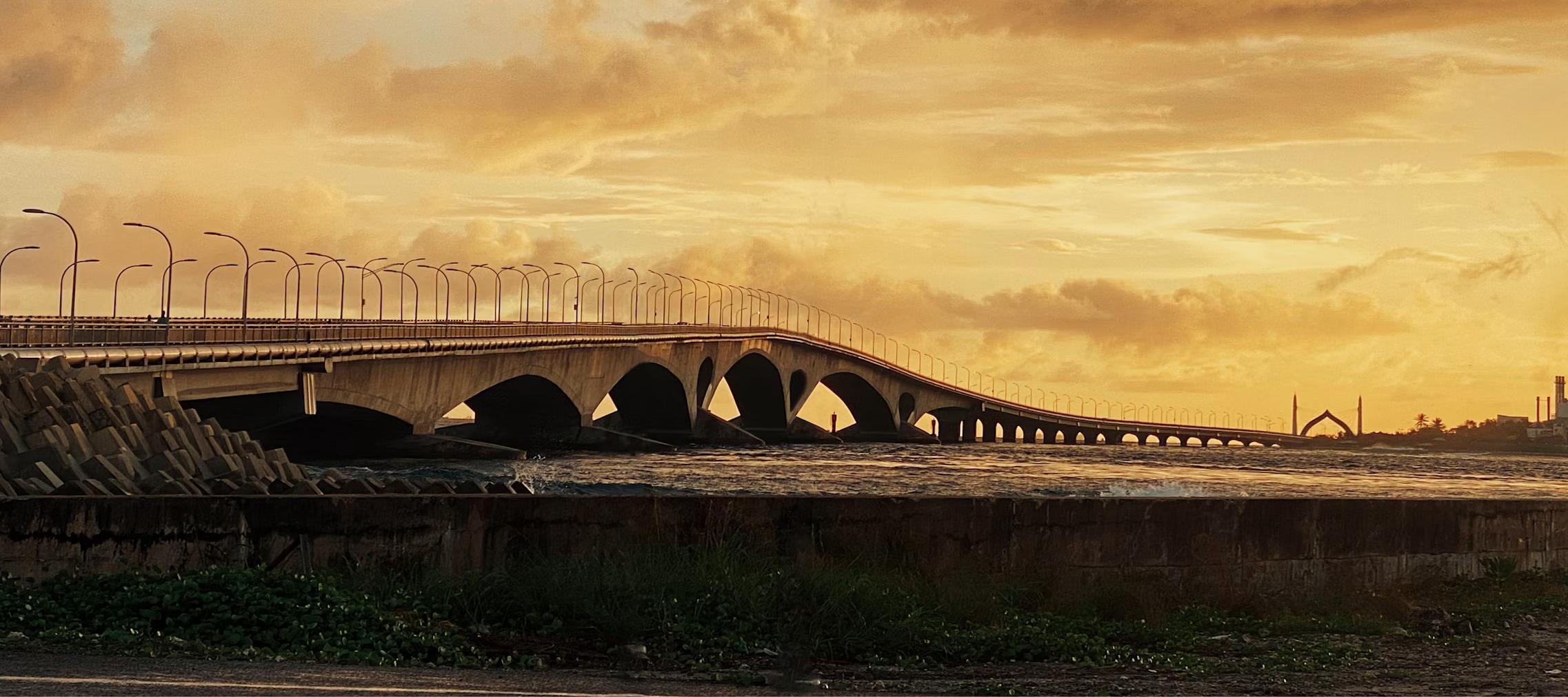 projects and infrastructure Projects and infrastructure law: Sinamalé Bridge at sunset, Malé